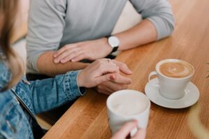 Man and woman holding hands