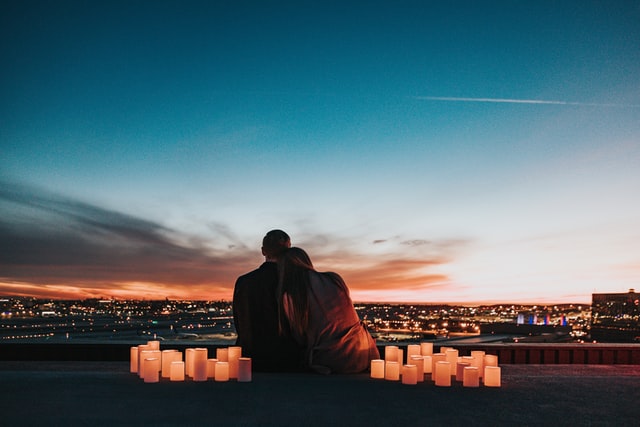 couple facing the city